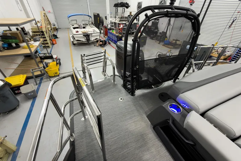 Slide: The Image of 2026 Godfrey Monaco 23' Tritoon in workshop, featuring sleek design and modern amenities. - 45