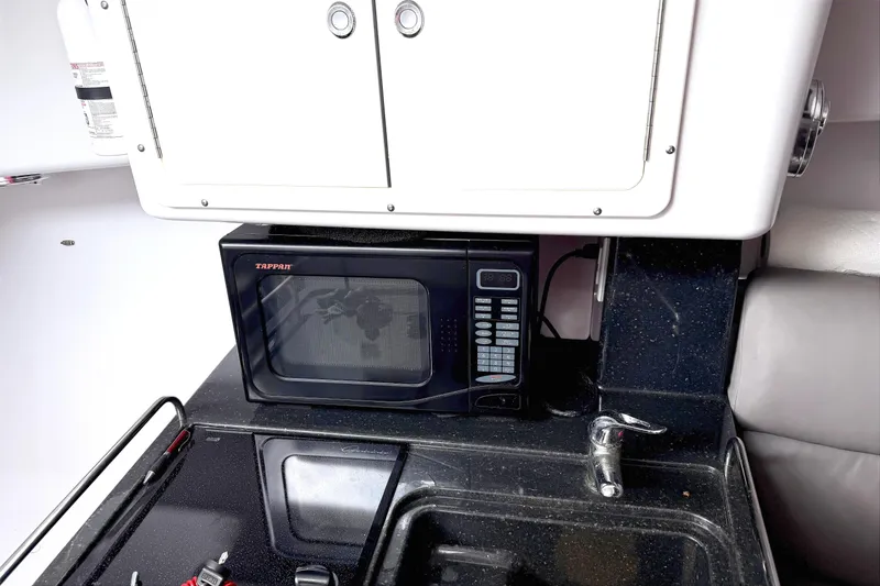 Slide: The Image of Dashboard of 2008 Southport 28 Express boat with navigation and communication equipment. - 9