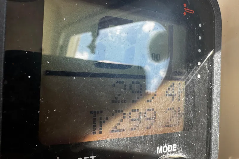 Slide: The Image of Close-up of a Parker 2520 XLD Sport Cabin 2007 boat dashboard display. - 12