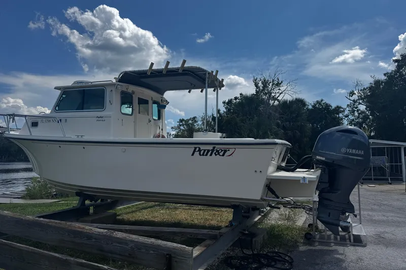 Slide: The Image of 2007 Parker 2520 XLD Sport Cabin boat on trailer with Yamaha outboard motor. - 2