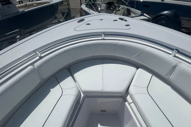 Slide: The Image of 2025 Sportsman Heritage 231 Center Console boat with spacious white seating area. - 14