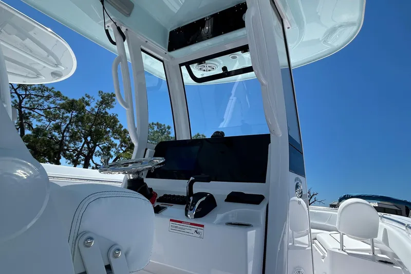Slide: The Image of 2025 Sportsman Heritage 231 Center Console interior with steering wheel and controls. - 4
