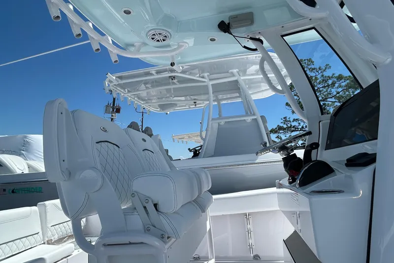 Slide: The Image of 2025 Sportsman Heritage 231 Center Console boat interior with modern seating and controls. - 5