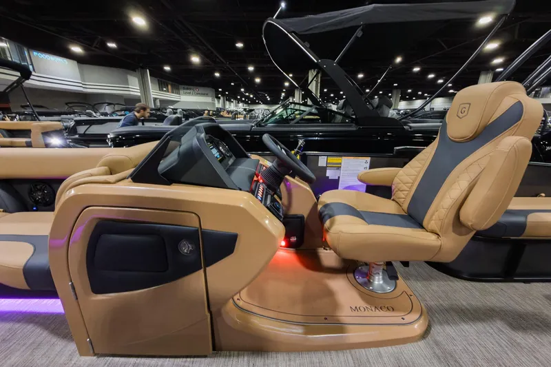 Slide: The Image of Luxurious interior of 2026 Godfrey Monaco 235 SFL boat with plush seating and modern dashboard. - 10
