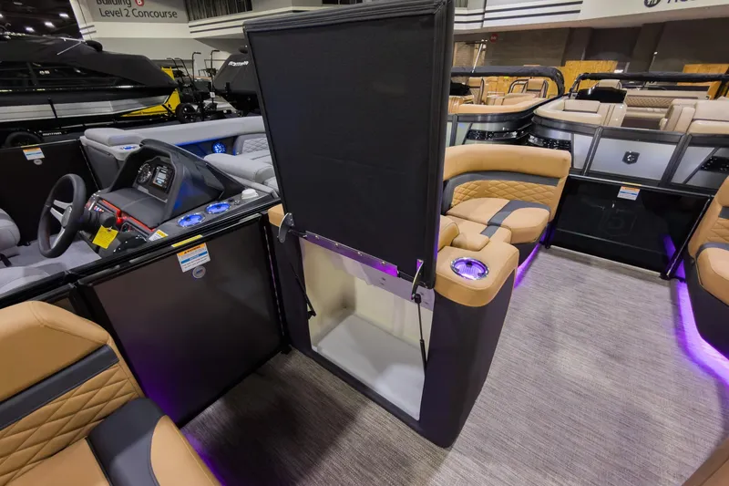 Slide: The Image of 2026 Godfrey Monaco 235 SFL boat interior with luxurious seating and modern dashboard. - 22