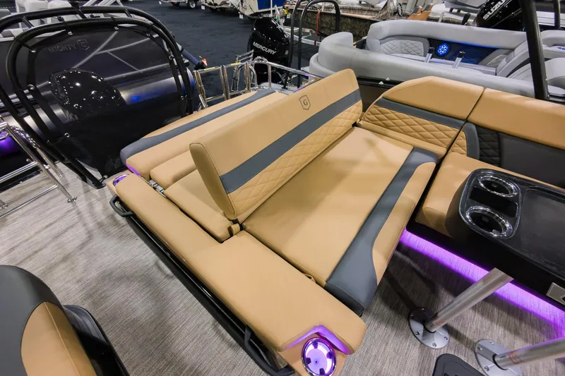 Slide: The Image of 2026 Godfrey Monaco 235 SFL boat with luxurious tan seating and ambient lighting. - 23