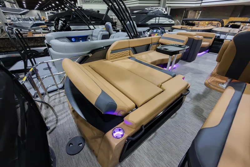Slide: The Image of 2026 Godfrey Monaco 235 SFL boat with luxurious tan seating and ambient lighting. - 26