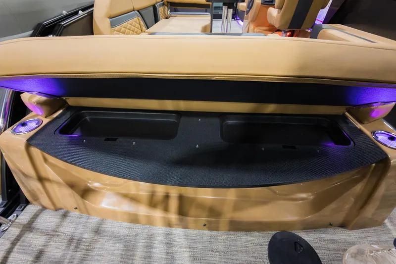 Slide: The Image of 2026 Godfrey Monaco 235 SFL boat interior with storage compartment and ambient lighting. - 27
