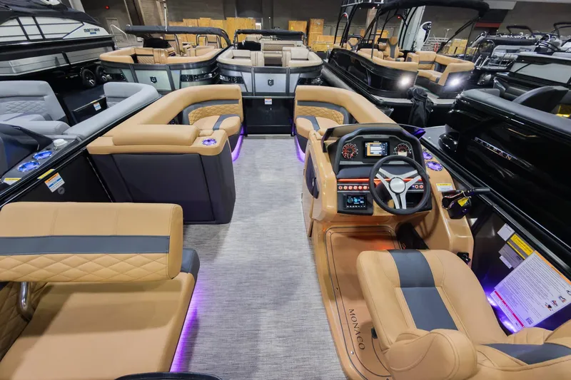 Slide: The Image of Luxurious interior of 2026 Godfrey Monaco 235 Single Flip Lounge pontoon boat, featuring plush seating and modern controls. - 33