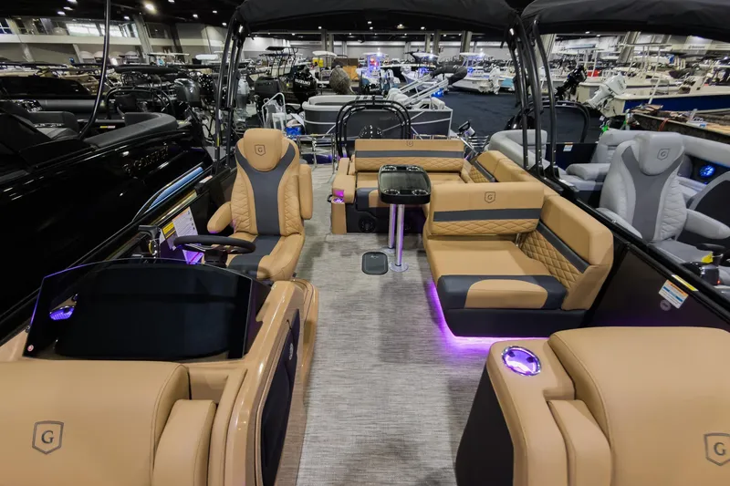 Slide: The Image of Luxurious interior of 2026 Godfrey Monaco 235 SFL pontoon boat with elegant seating and ambient lighting. - 9