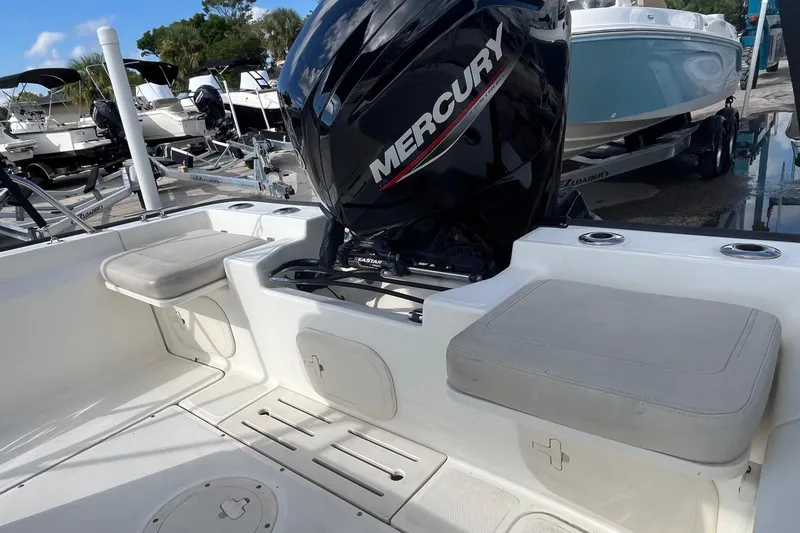 Slide: The Image of 2022 Boston Whaler 170 Montauk with Mercury engine, featuring spacious seating and storage. - 10