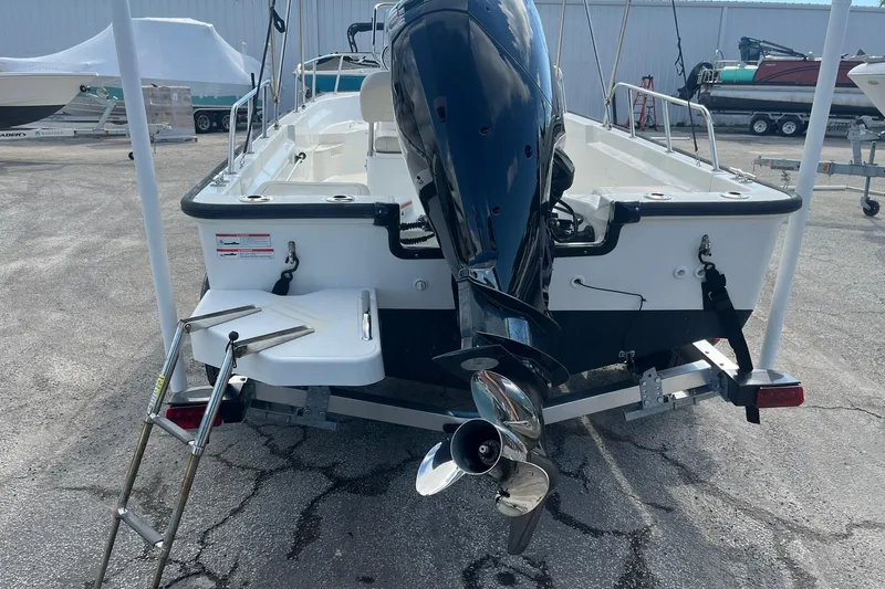 Slide: The Image of 2022 Boston Whaler 170 Montauk boat rear view with outboard motor and ladder. - 5