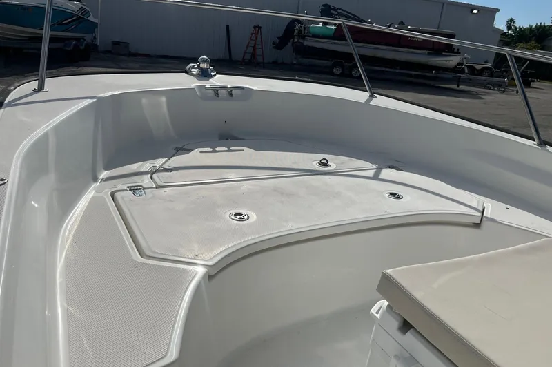 Slide: The Image of 2022 Boston Whaler 170 Montauk boat interior, featuring spacious deck and seating area. - 7