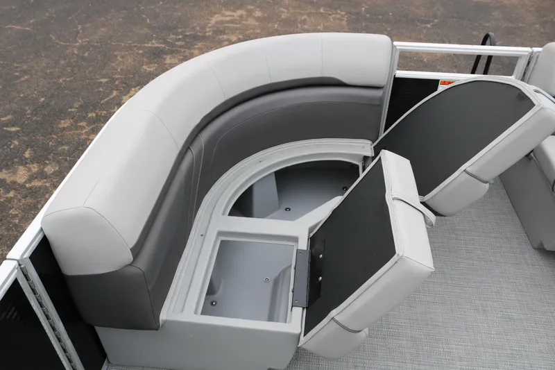 Slide: The Image of 2026 Bennington 20SXSNP REAR FISH boat with open storage compartment under gray seating. - 14