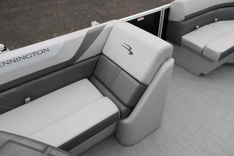 Slide: The Image of 2026 Bennington 20SXSNP REAR FISH boat interior storage compartment open on deck. - 22
