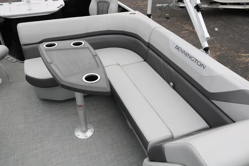 Slide: The Image of 2026 Bennington 20SXSNP REAR FISH boat interior with gray seating and flooring. - 24