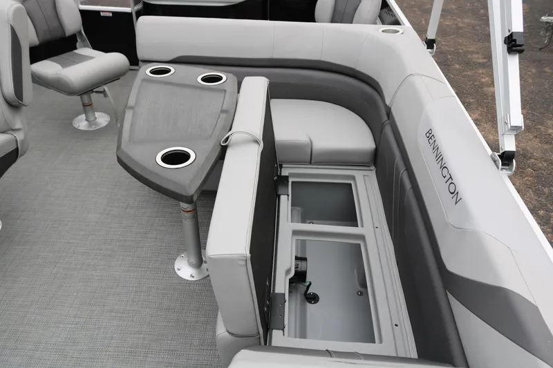 Slide: The Image of 2026 Bennington 20SXSNP REAR FISH pontoon boat interior with seating and storage. - 25