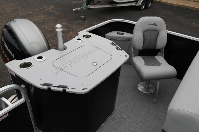 Slide: The Image of 2026 Bennington 20SXSNP REAR FISH boat interior with storage compartment open. - 29