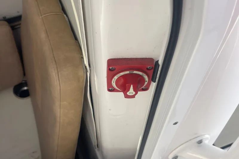 Slide: The Image of Red switch on 2019 Sportsman Open 242 Center Console boat interior. - 12