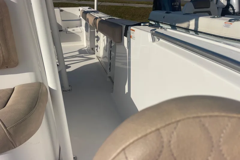 Slide: The Image of 2019 Sportsman Open 242 Center Console boat interior with cushioned seating. - 21