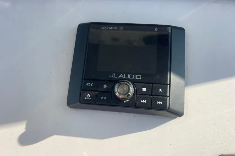 Slide: The Image of JL Audio MediaMaster 50 control panel on 2019 Sportsman Open 242 Center Console boat. - 33