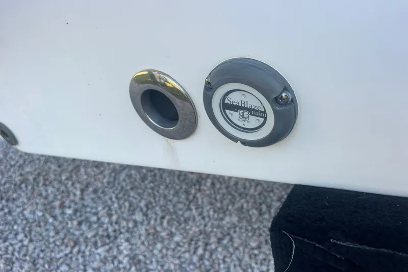 Slide: The Image of Close-up of SeaBlaze Mini light on 2019 Sportsman Open 242 Center Console boat. - 38