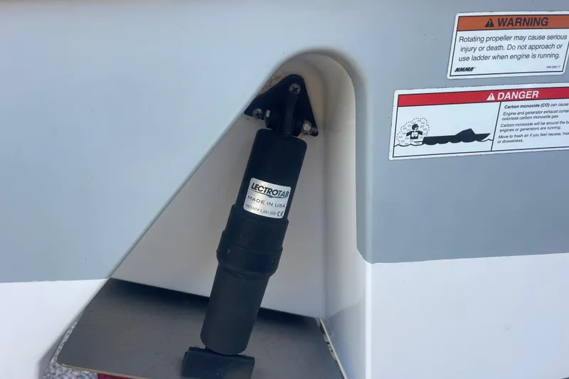 Slide: The Image of Close-up of a 2019 Sportsman Open 242 Center Console boat component with warning labels. - 40