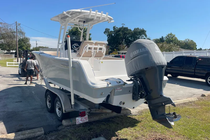 Slide: The Image of 2019 Sportsman Open 242 Center Console boat on trailer with Yamaha engine. - 5