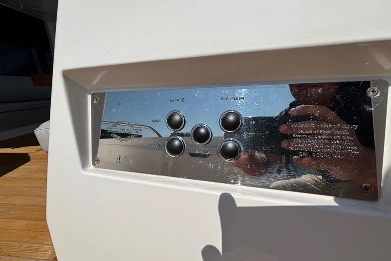Slide: The Image of Control panel on 2018 Sunseeker Predator 74 yacht, featuring garage and platform buttons. - 17
