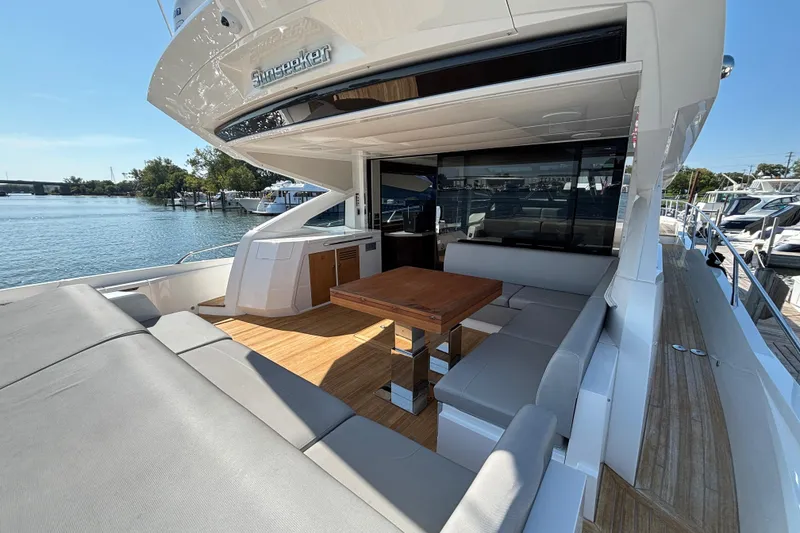 Slide: The Image of Luxurious 2018 Sunseeker Predator 74 yacht with spacious outdoor seating and dining area. - 19