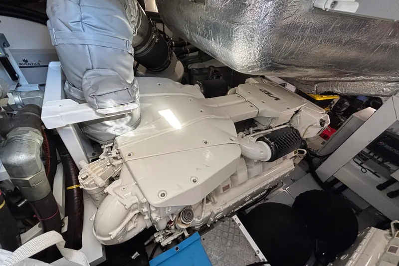 Slide: The Image of Engine room of a 2018 Sunseeker Predator 74 yacht, showcasing its powerful machinery. - 25