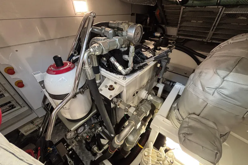 Slide: The Image of Engine room of 2018 Sunseeker Predator 74 yacht, showcasing mechanical components and systems. - 27