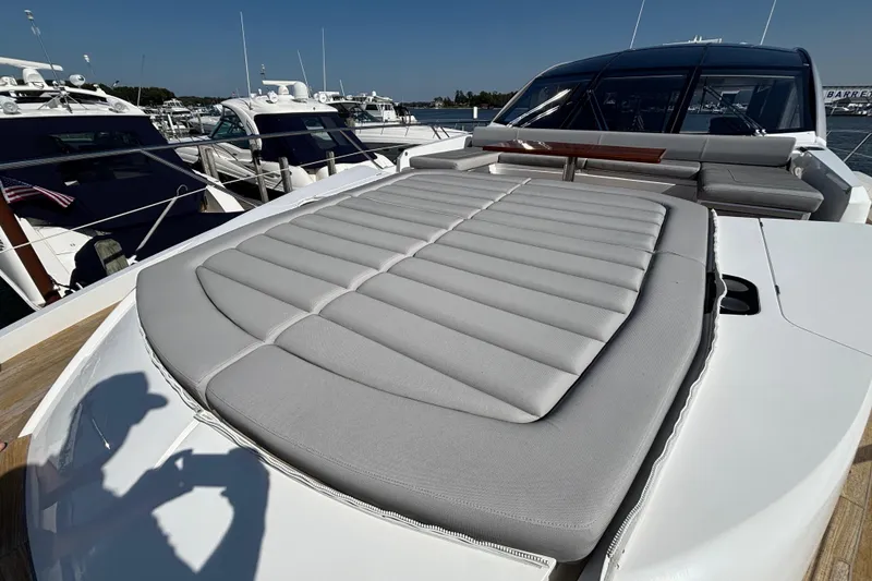 Slide: The Image of 2018 Sunseeker Predator 74 yacht with spacious sunbed and sleek design at marina. - 31