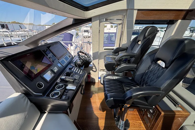 Slide: The Image of Luxurious cockpit of 2018 Sunseeker Predator 74 yacht with leather seats and advanced controls. - 38