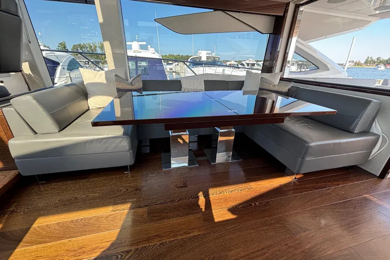 Slide: The Image of Luxurious interior of 2018 Sunseeker Predator 74 yacht with sleek seating and elegant table. - 49