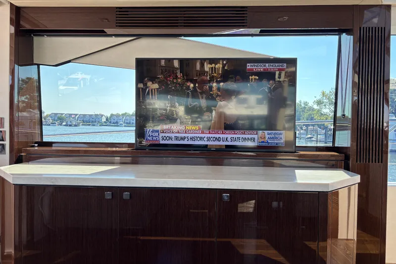 Slide: The Image of Luxurious interior of 2018 Sunseeker Predator 74 yacht with TV and scenic window view. - 53