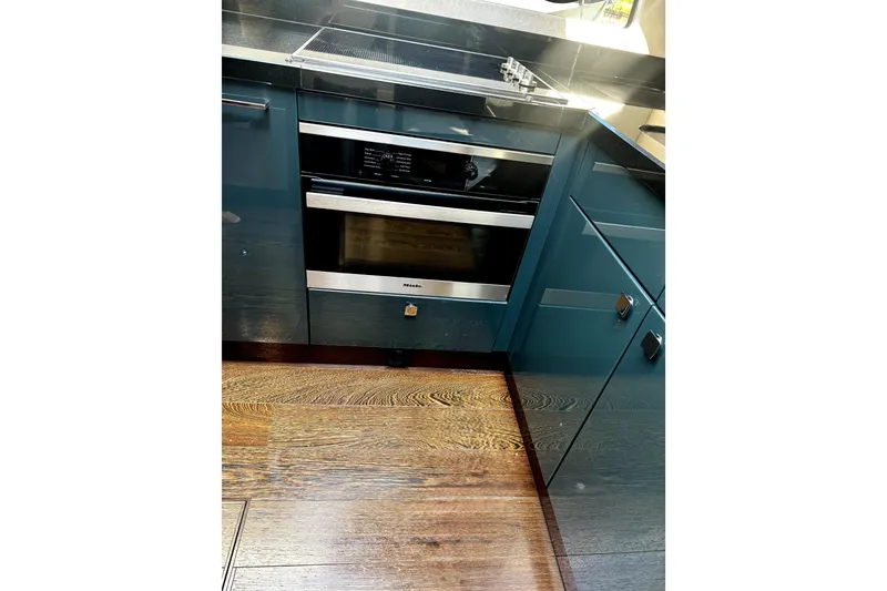 Slide: The Image of Modern kitchen in 2018 Sunseeker Predator 74 yacht with sleek cabinetry and built-in oven. - 61