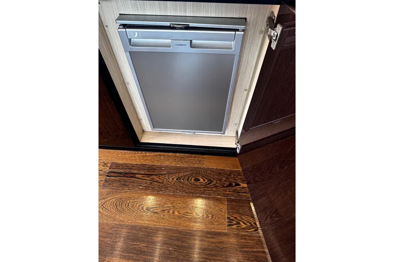 Slide: The Image of Built-in refrigerator on Sunseeker Predator 74 yacht, 2018 model, with elegant wood flooring. - 64