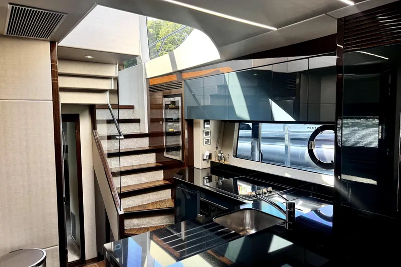 Slide: The Image of Luxurious interior of 2018 Sunseeker Predator 74 yacht with modern kitchen and staircase. - 68