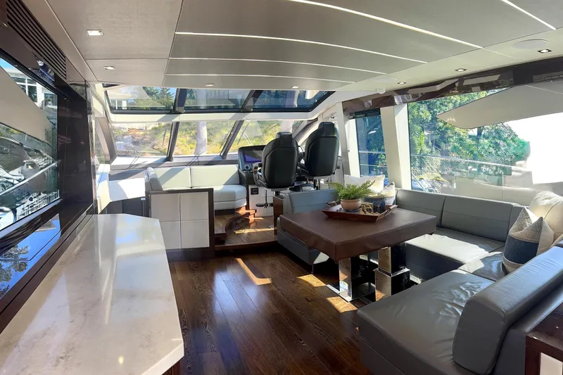 Slide: The Image of Luxurious interior of 2018 Sunseeker Predator 74 yacht with modern furnishings and panoramic windows. - 73