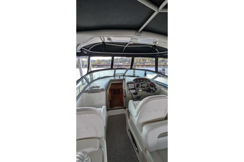 Slide: The Image of 2006 Sea Ray 340 Sundancer bathroom with toilet, sink, and storage cabinets. - 10
