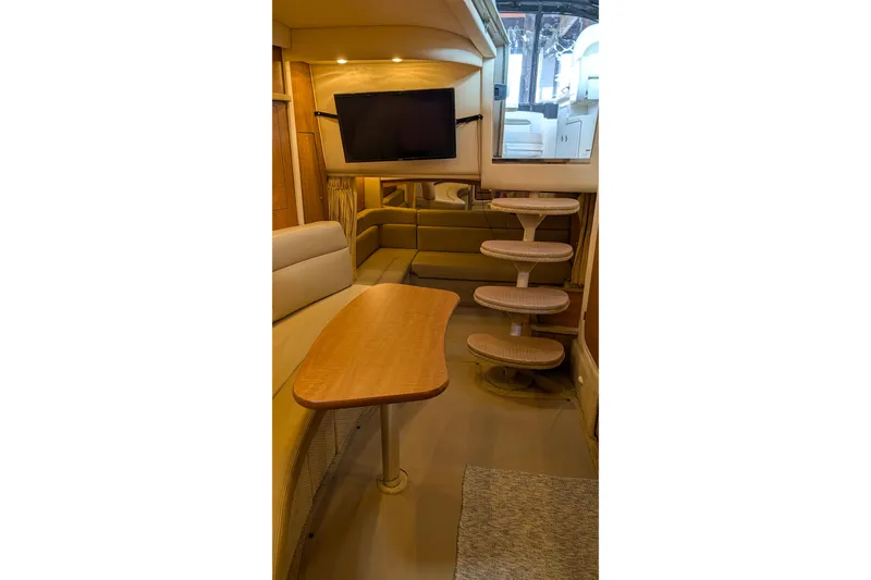 Slide: The Image of Luxurious interior of 2006 Sea Ray 340 Sundancer yacht with kitchen and sleeping area. - 5