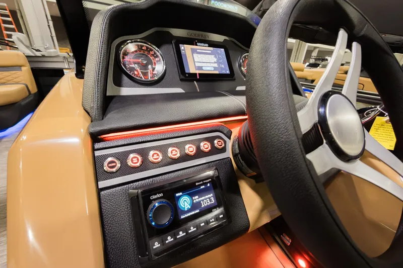 Slide: The Image of 2026 Godfrey Monaco 255 dashboard with modern controls and steering wheel. - 12