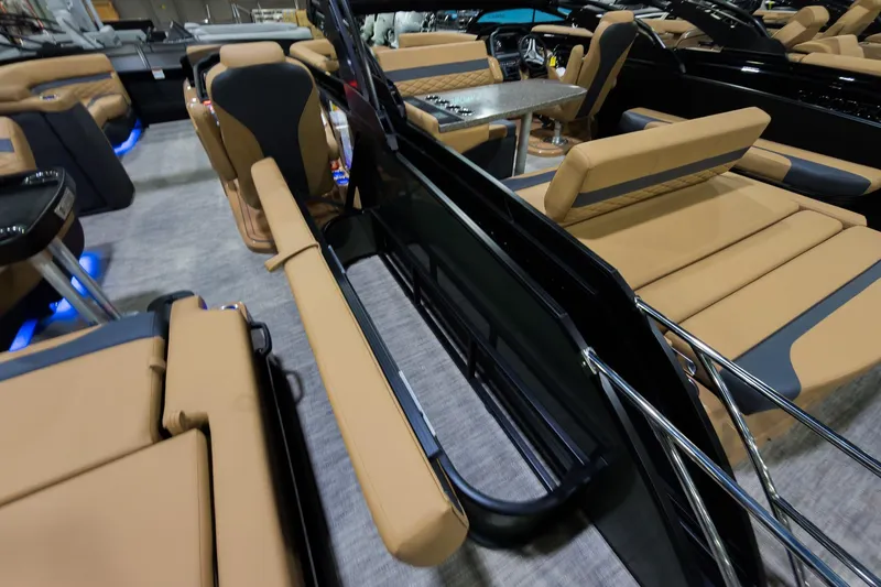 Slide: The Image of 2026 Godfrey Monaco 255 boat interior with tan seating and modern design. - 27