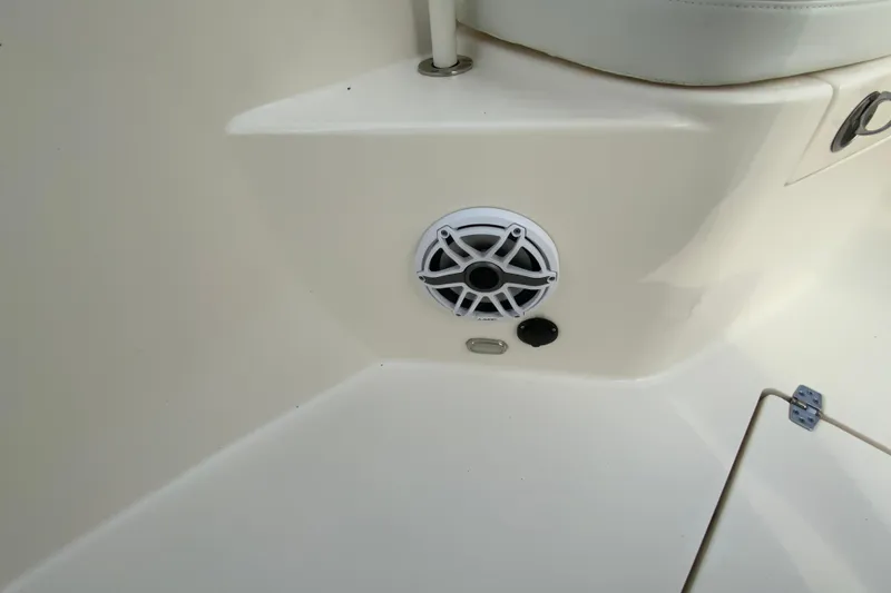Slide: The Image of 2023 Cobia 262 Center Console boat interior with speaker detail. - 58
