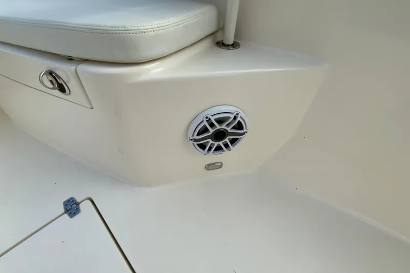Slide: The Image of 2023 Cobia 262 Center Console boat interior with speaker and seating detail. - 59