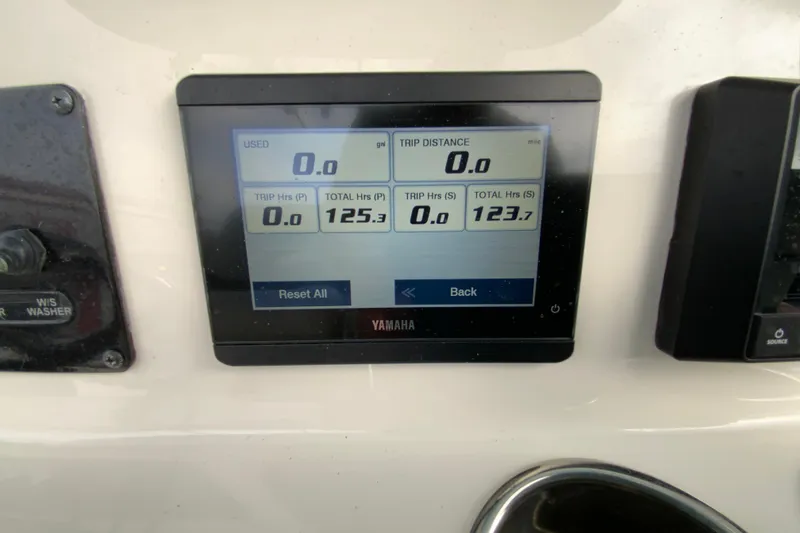 Slide: The Image of Yamaha display on 2023 Cobia 262 Center Console showing trip and fuel data. - 63