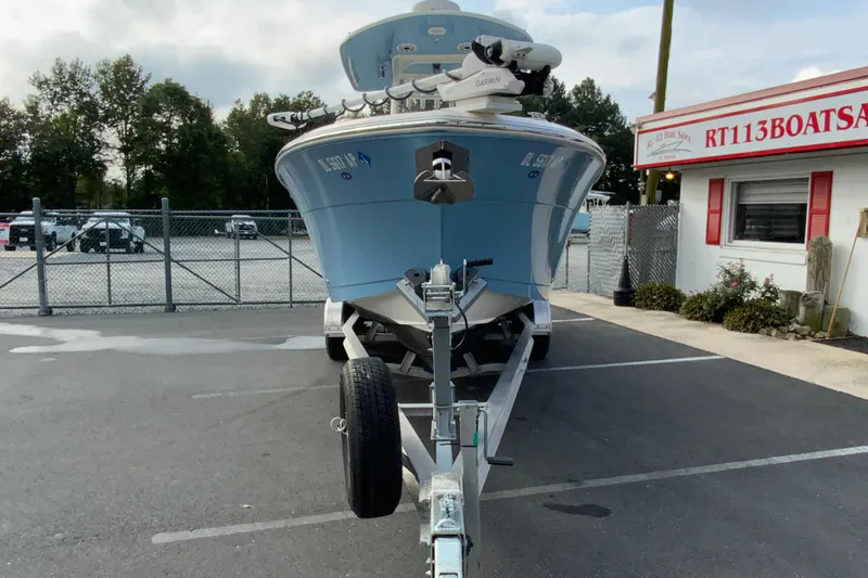 Slide: The Image of 2023 Cobia 262 Center Console boat on trailer at dealership parking lot. - 7