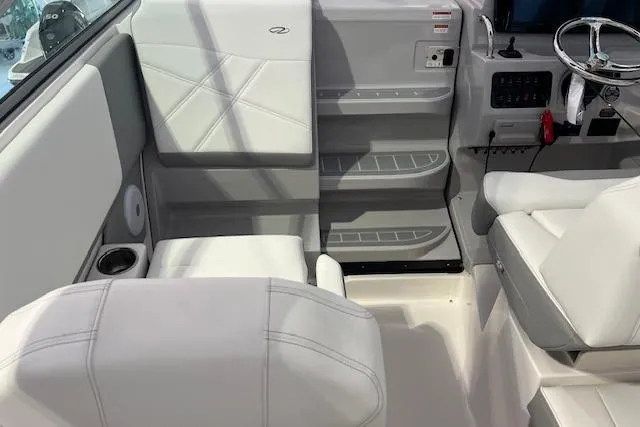 Slide: The Image of 2026 Regal 26 XO boat interior with white seating and modern dashboard. - 10