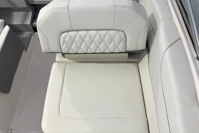 Slide: The Image of 2026 Regal 26 XO boat seat with white leather and diamond stitching. - 7